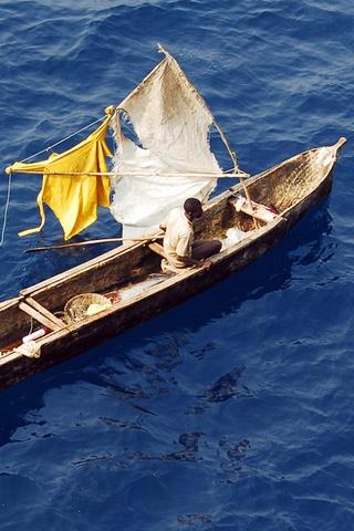 Man in Canoe, Guinea #philrickphotos Man in Canoe, Guinea